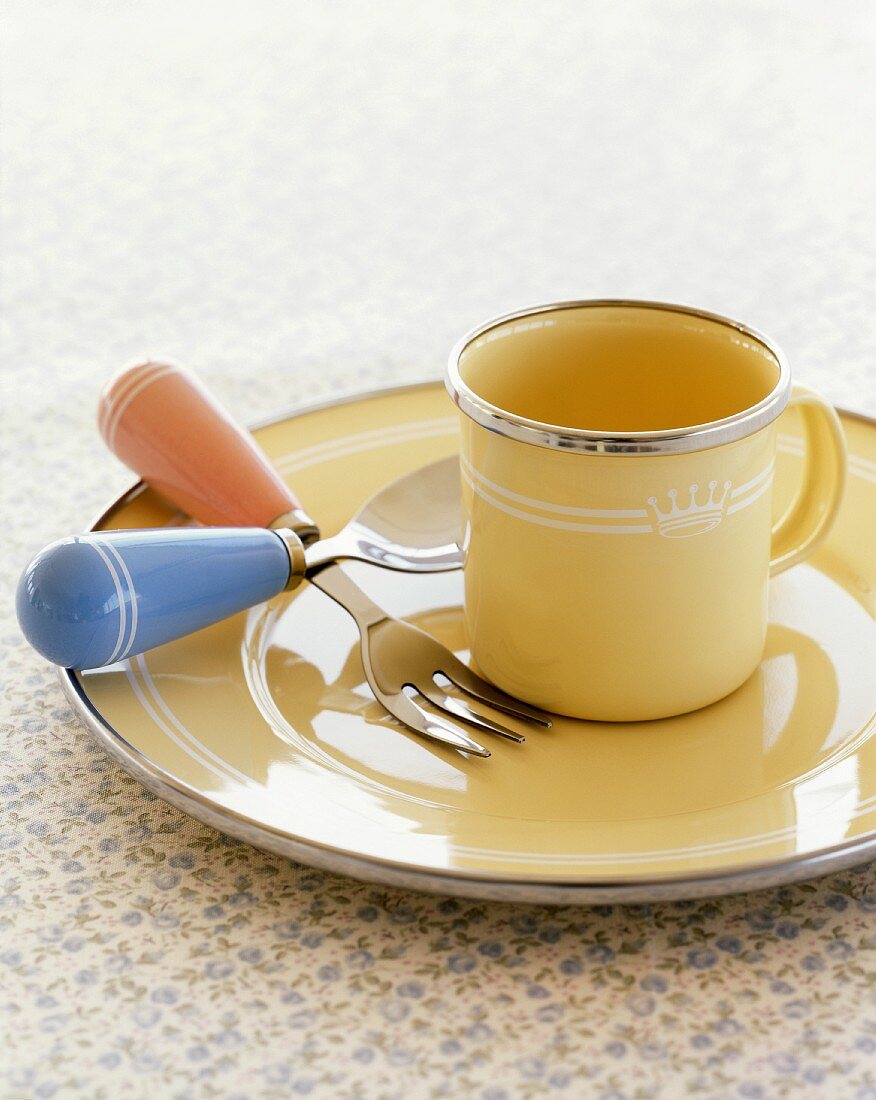 Metal cup, plate, fork and spoon (children's tableware)
