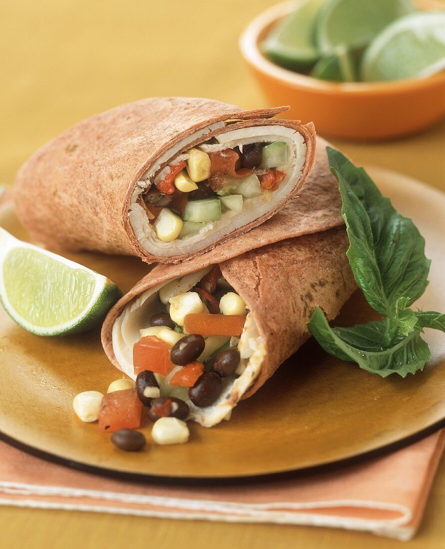 Tomato wraps filled with turkey, black beans and sweetcorn