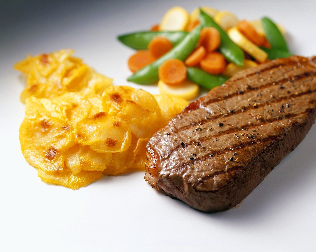 Grilled Beef with Scalloped Potatoes and Mixed Vegetables