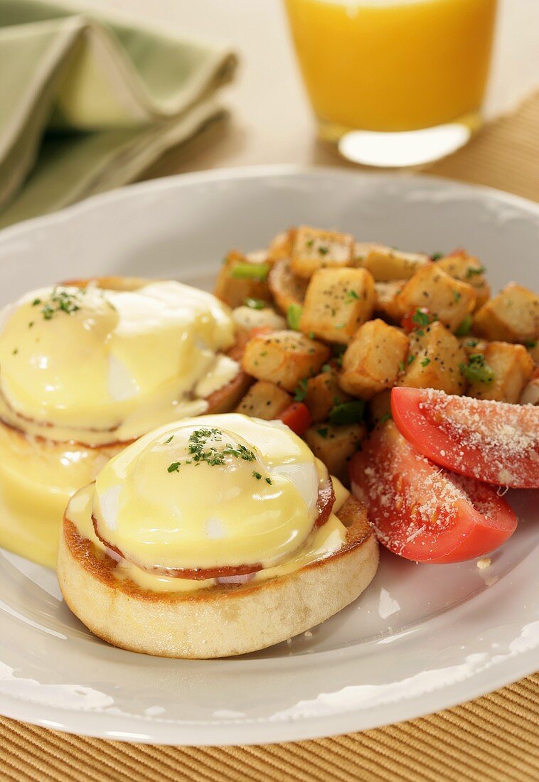 Eggs Benedict with Tomatoes and Home Fries