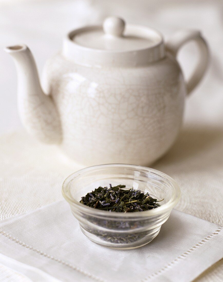 Dried tea leaves and teapot