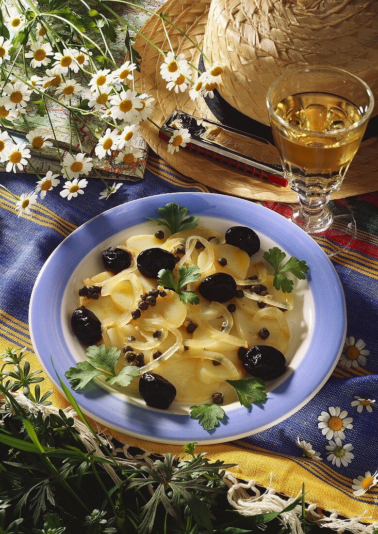 Potato salad with capers, olives and onions