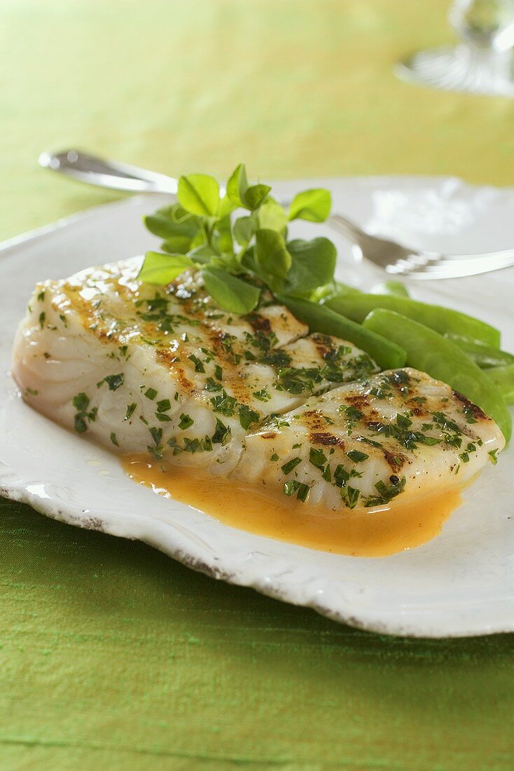 Halibut with chili butter sauce and herbs