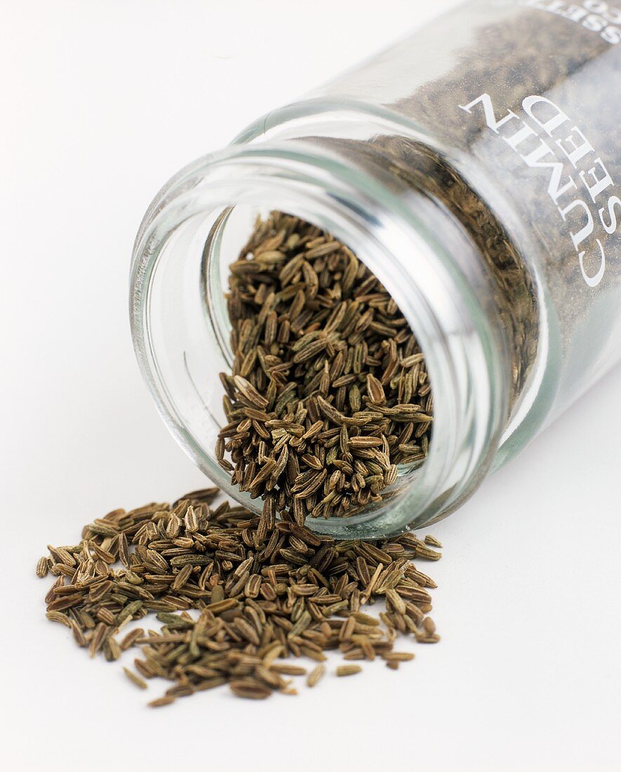 Cumin seed falling out of a jar