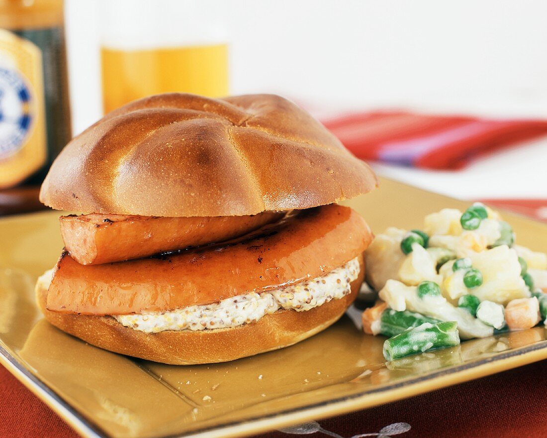 Kielbasa Sandwich on a Kaiser Roll with a Side of Potato Salad