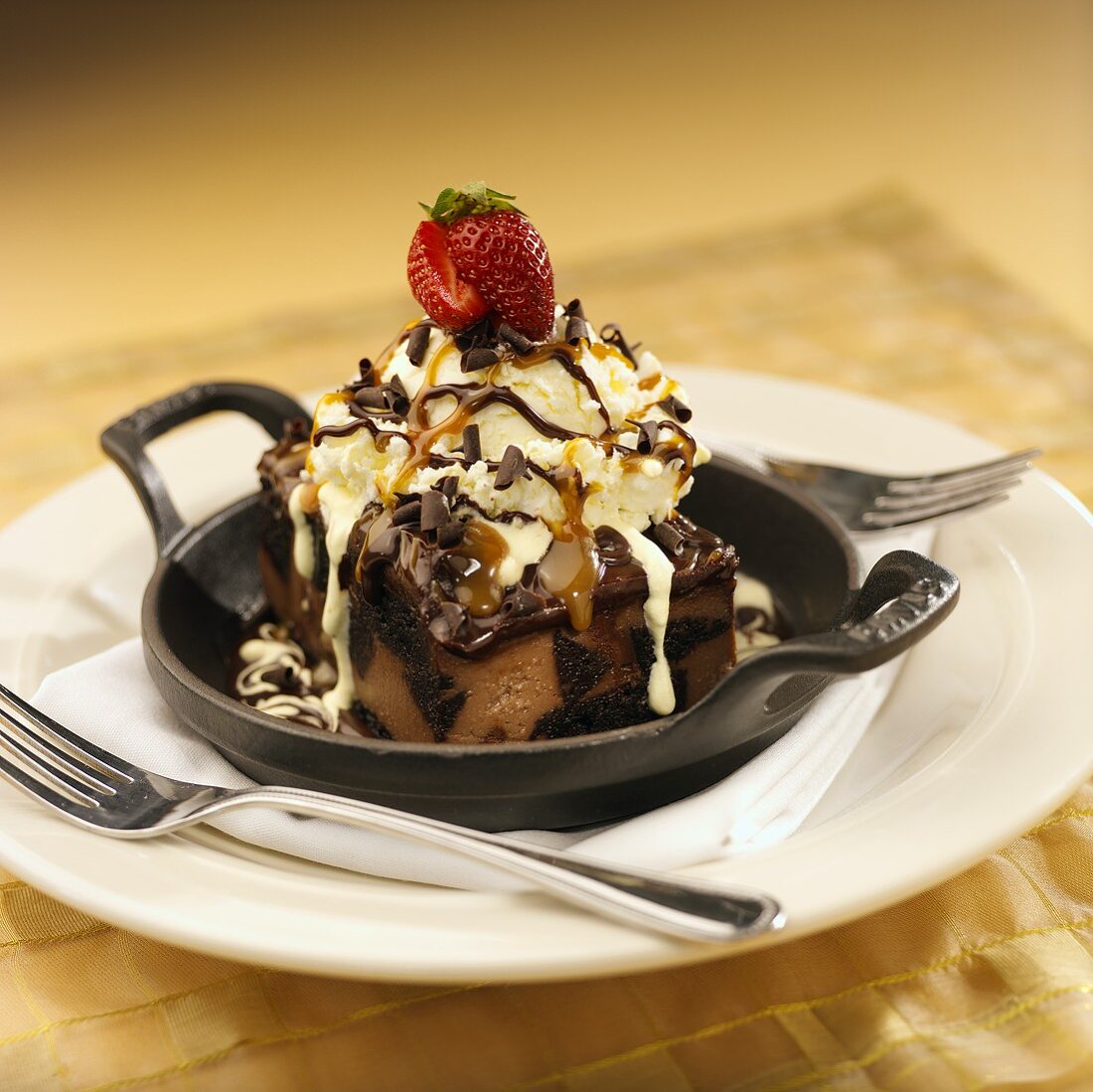 Chocolate mousse cake with vanilla ice cream & caramel sauce