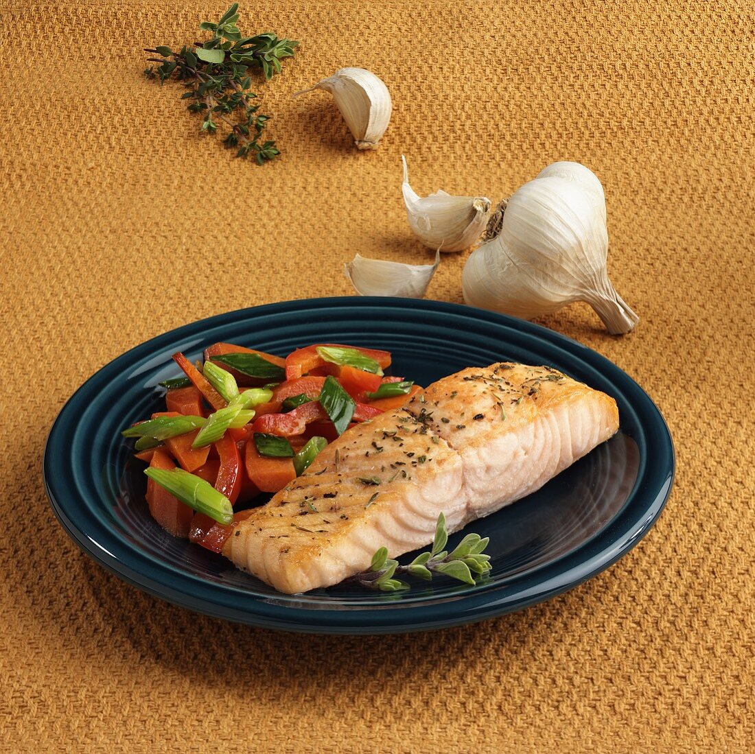 Salmon fillet with peppers and spring onions