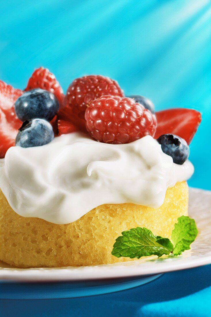 Sponge Cake Topped with Whipped Cream and Berries