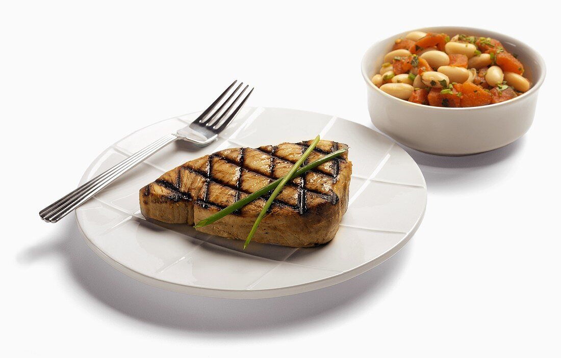 A Grilled Tuna Steak with White Beans and Tomatoes