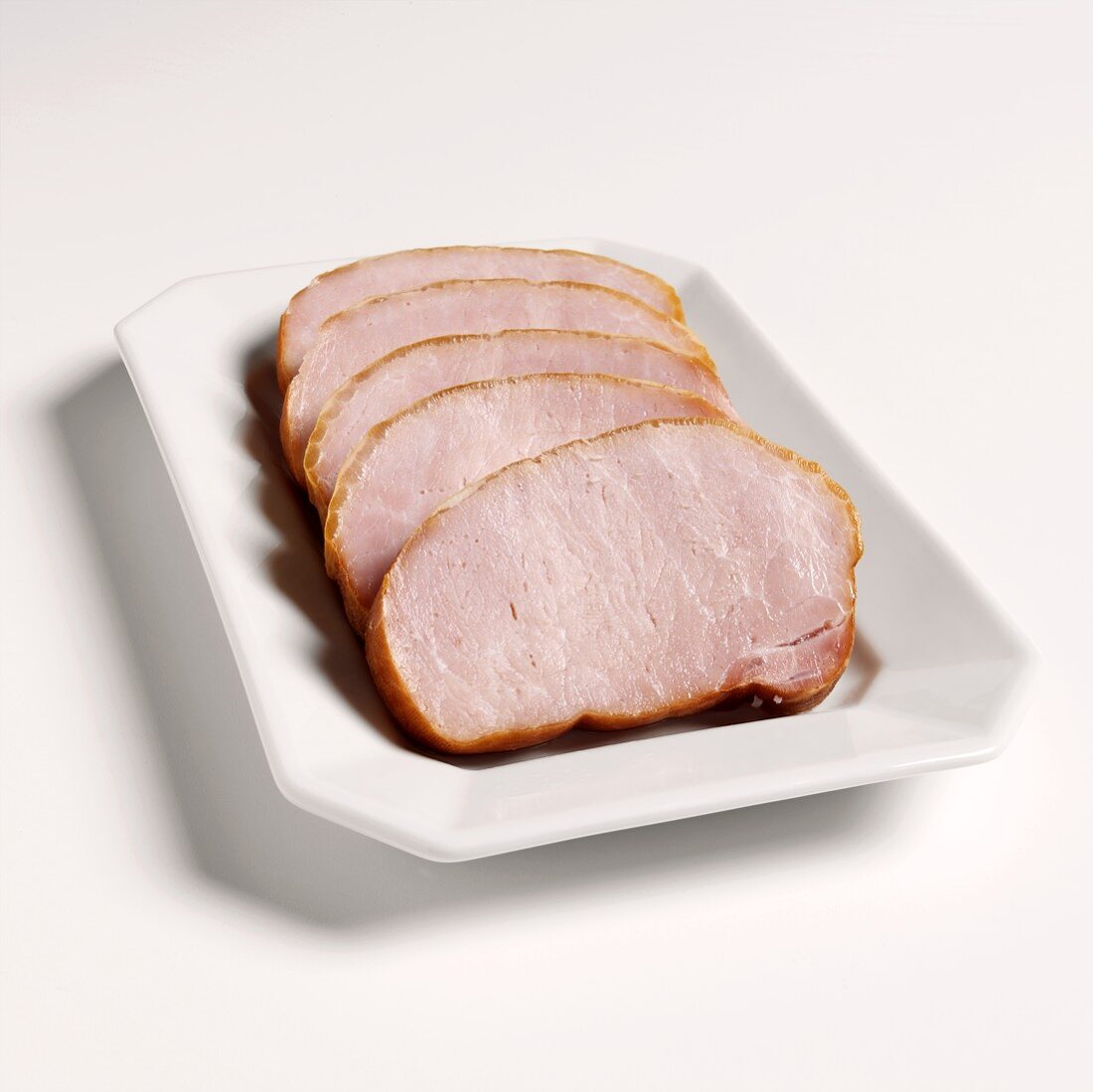 Smoked pork chops on white platter
