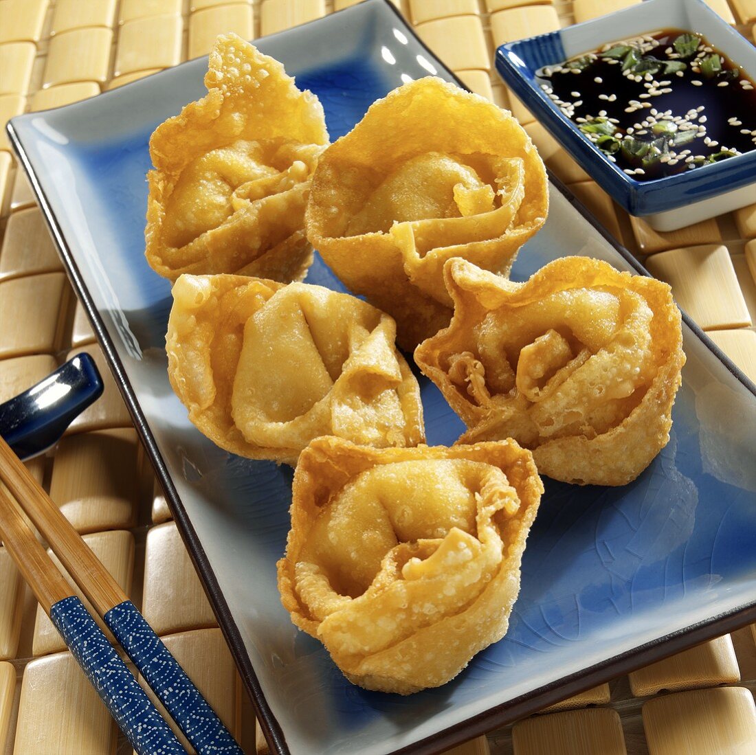 Deep-fried won ton parcels with soy sauce (Crab Rangoon)