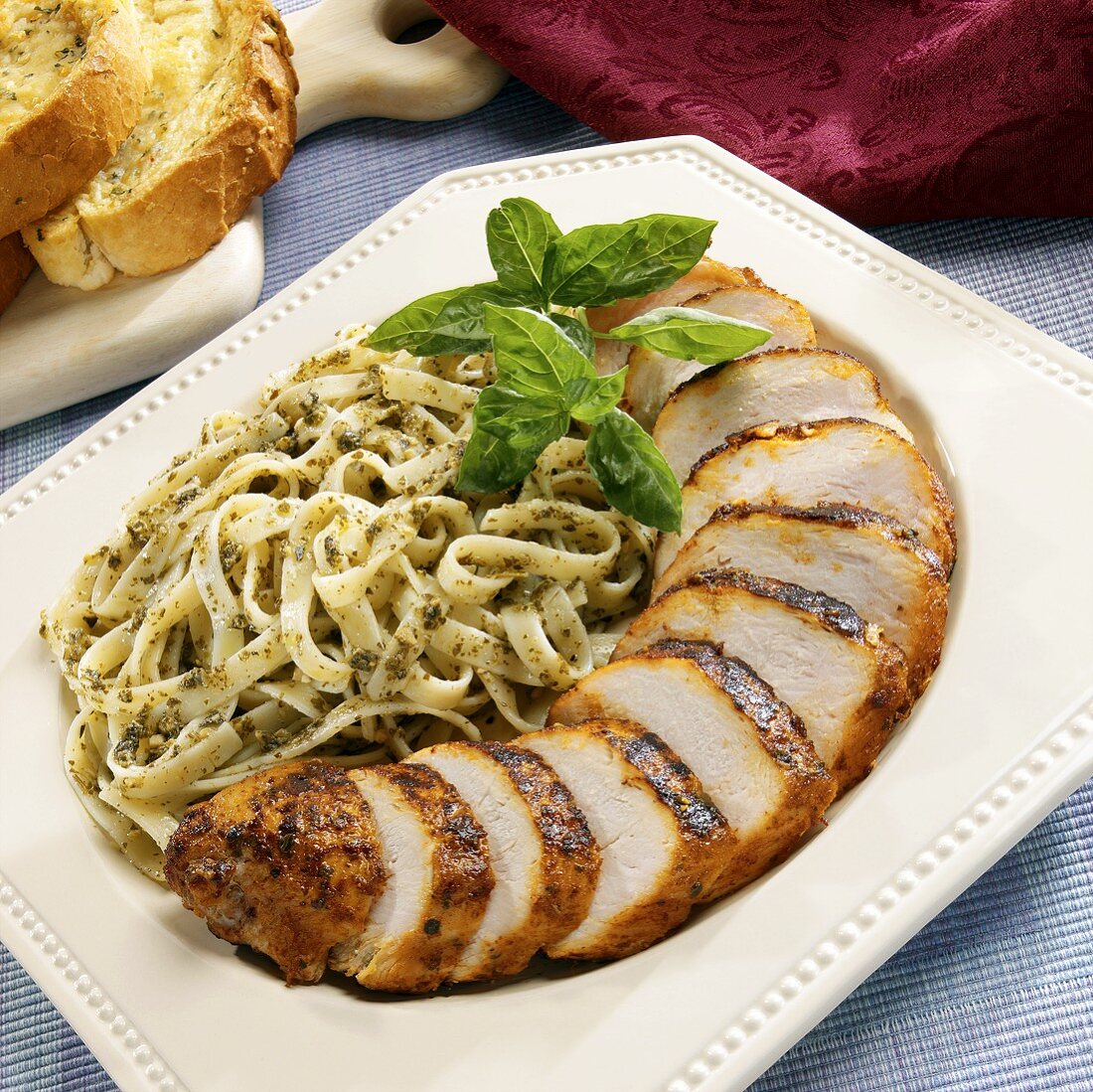 Barbecued chicken breast, sliced, with pesto pasta