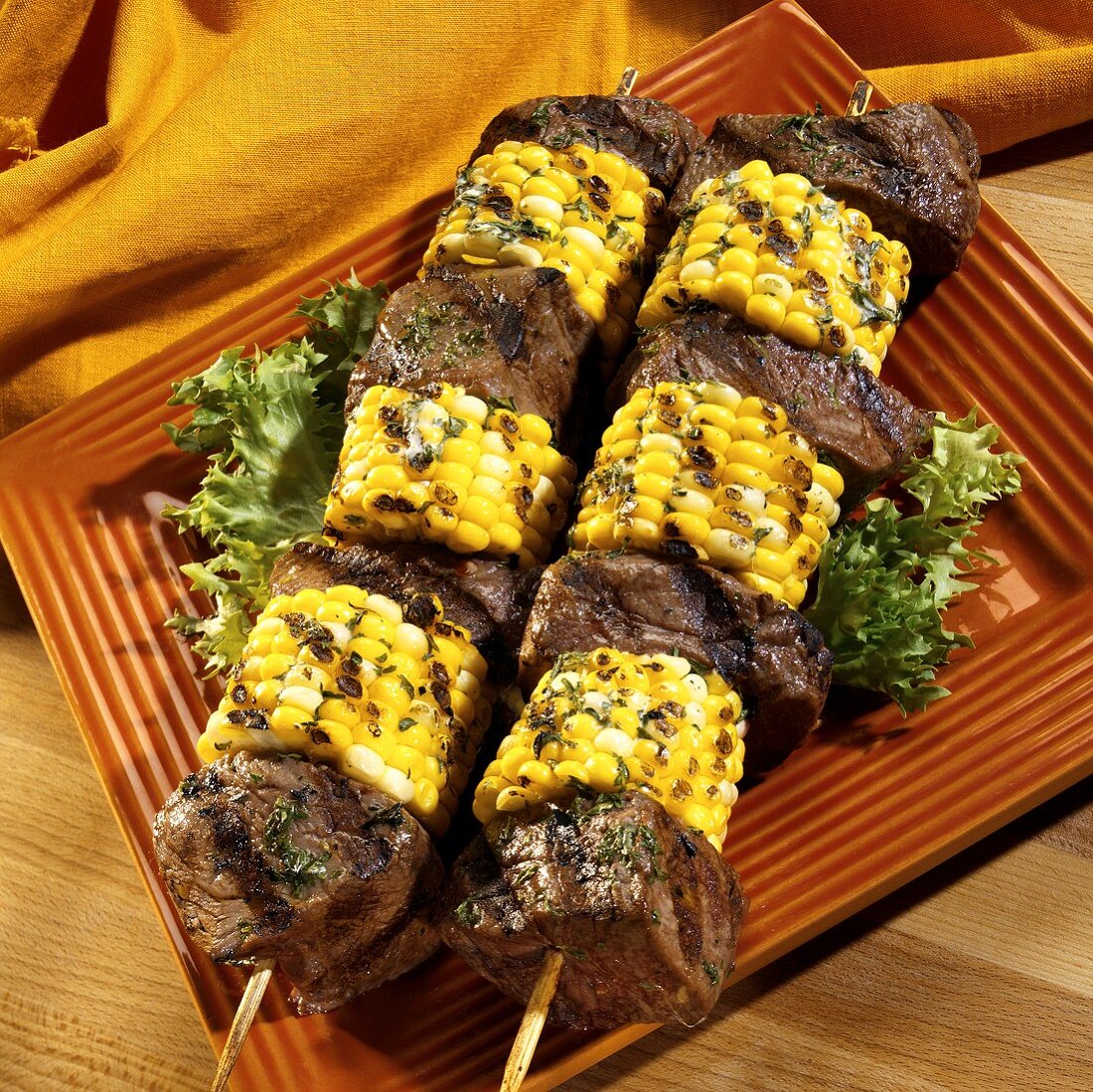 Beef fillet and sweetcorn kebabs with herb butter
