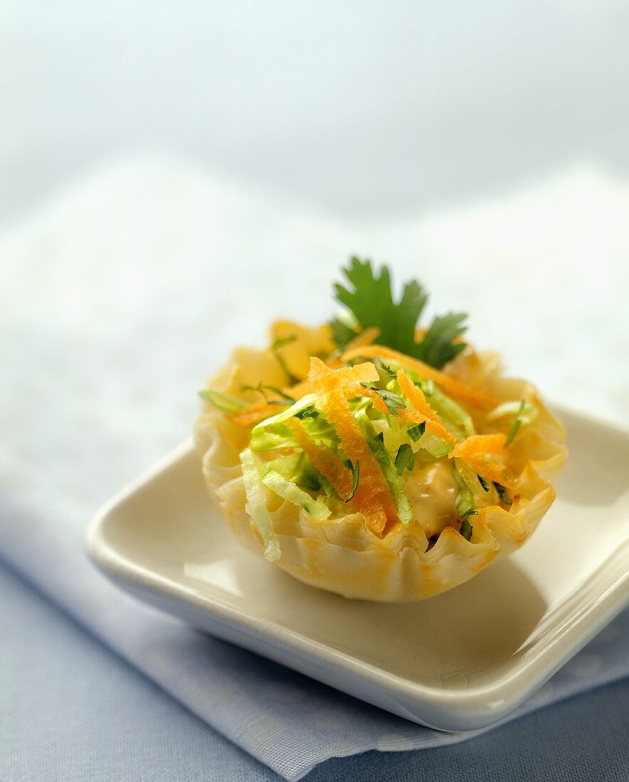 A Puff Pastry Shell Filled with Cheese and Salad