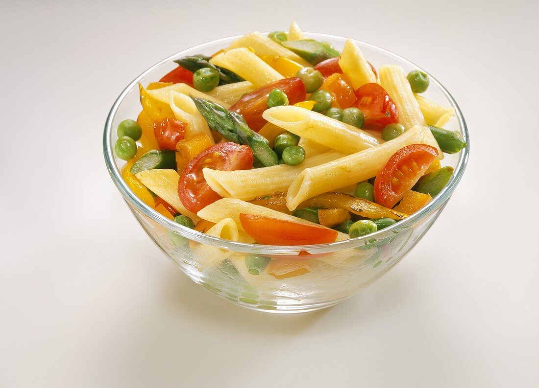Penne with Tomatoes, Peas and Bell Peppers in a Glass Bowl