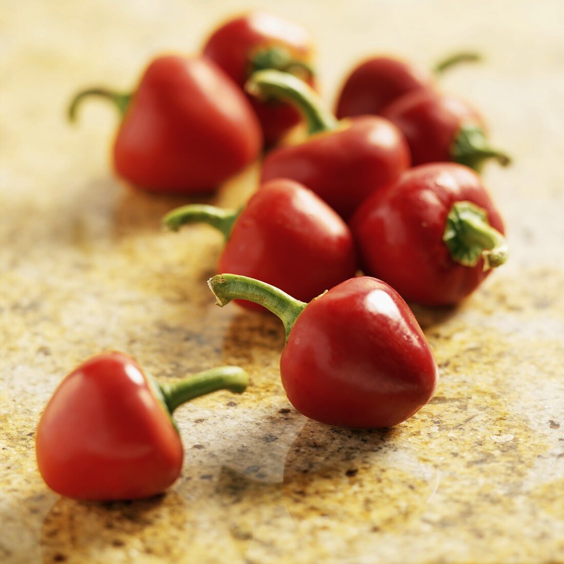 Fresh Cherry Peppers on Granite