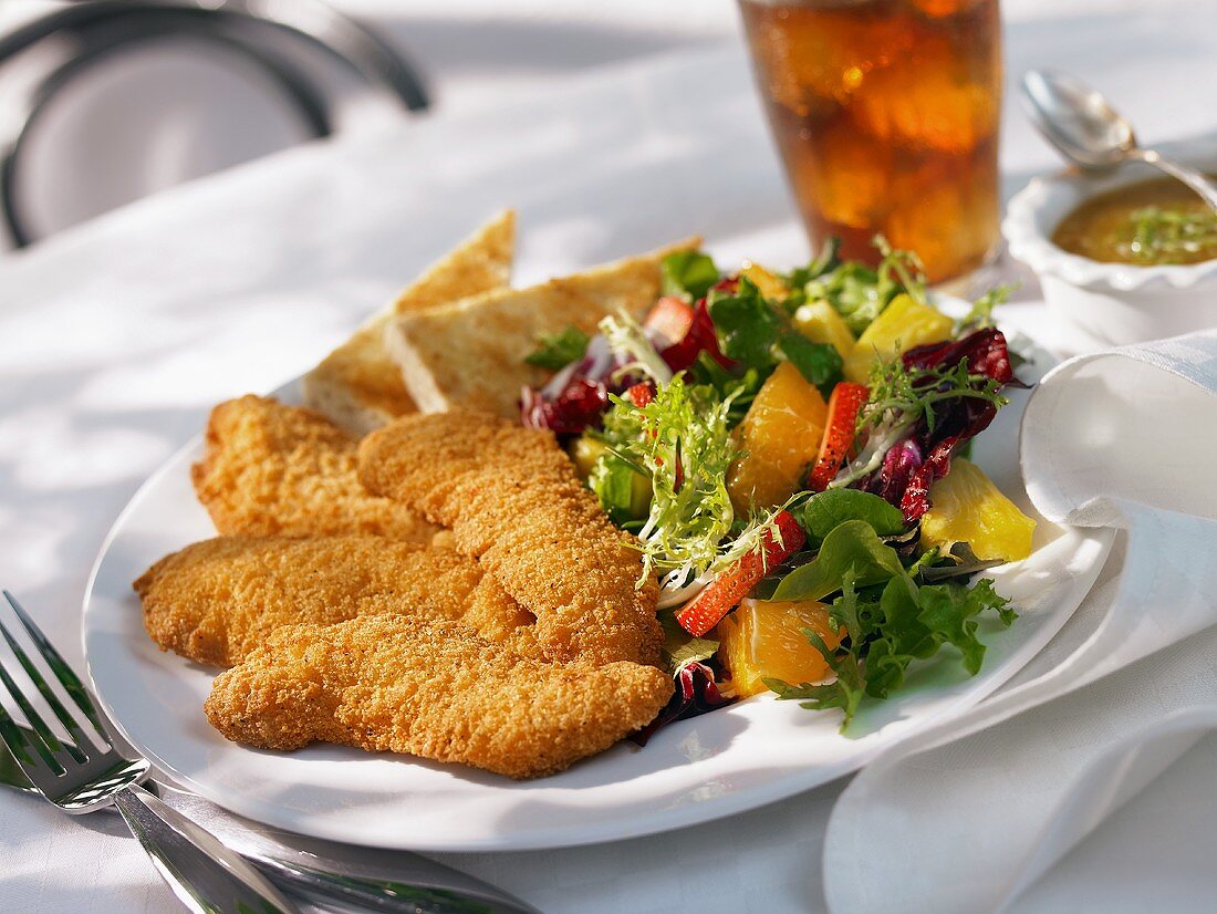 Fried Chicken Strips with Salad and Iced Tea