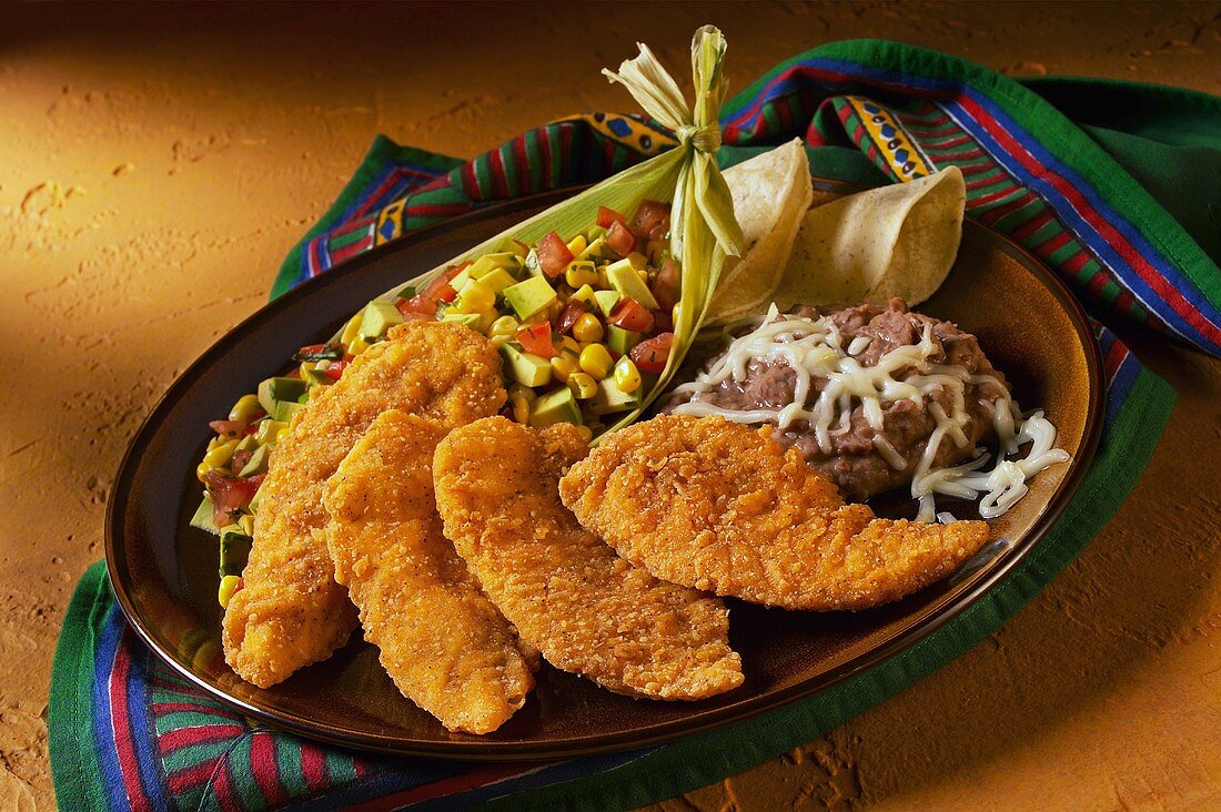 Southwestern Style Chicken Tenders with Corn Salad and Refried Beans