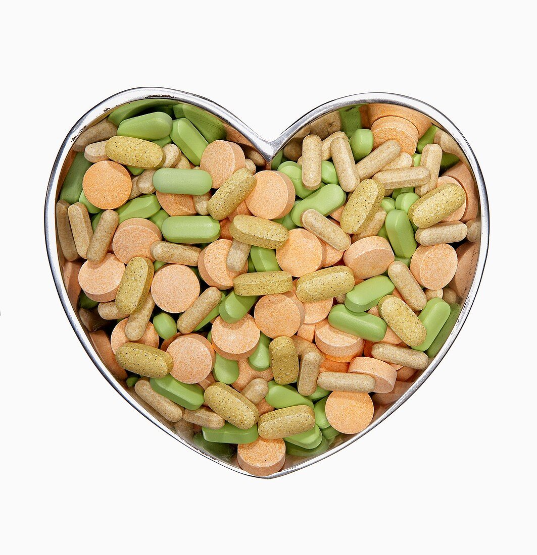 Assorted Pills in a Heart Shaped Bowl