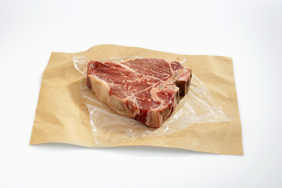 Raw Porterhouse Steak on Butcher's Paper