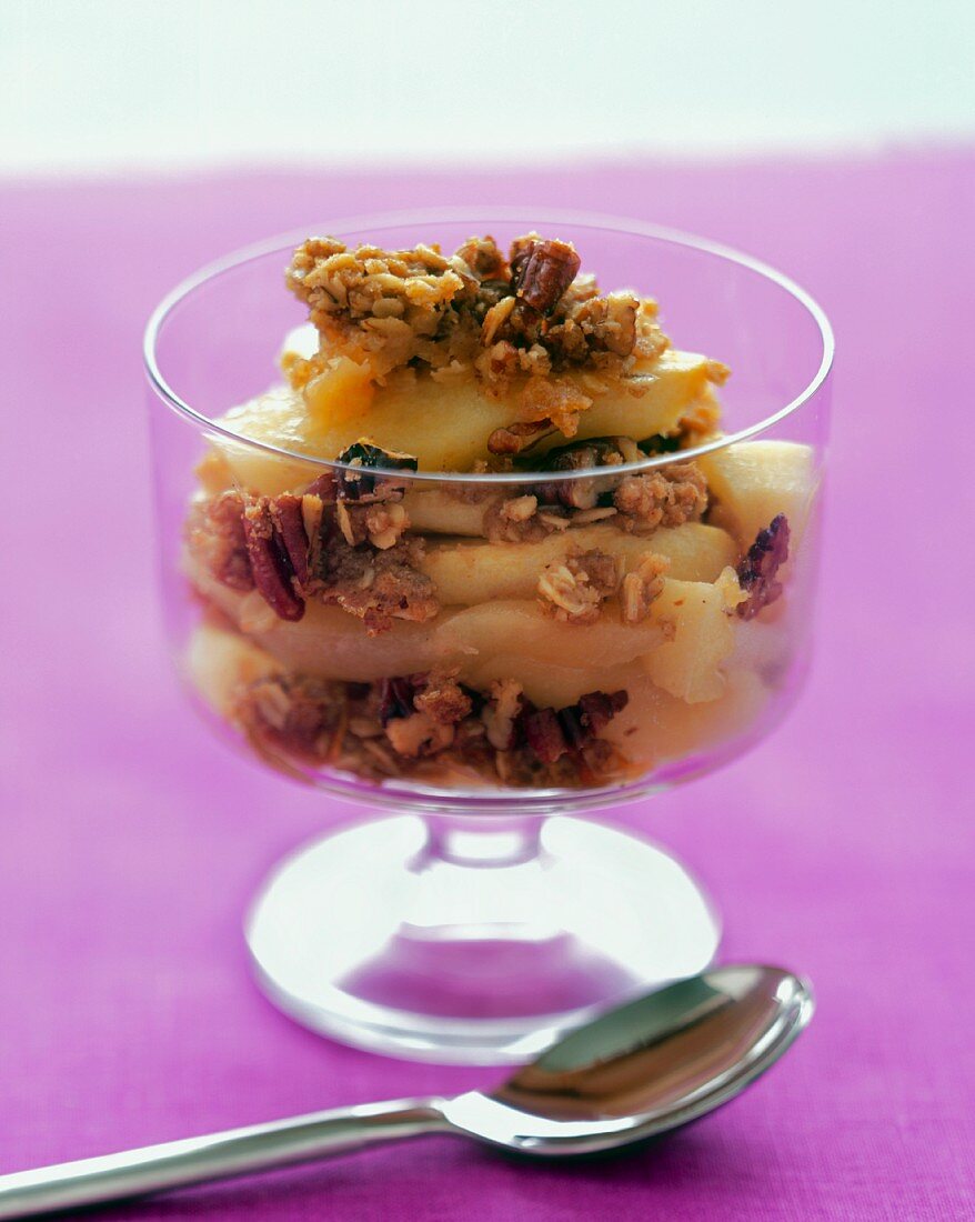 Apple Crumble in a Dessert Glass on Purple Linen