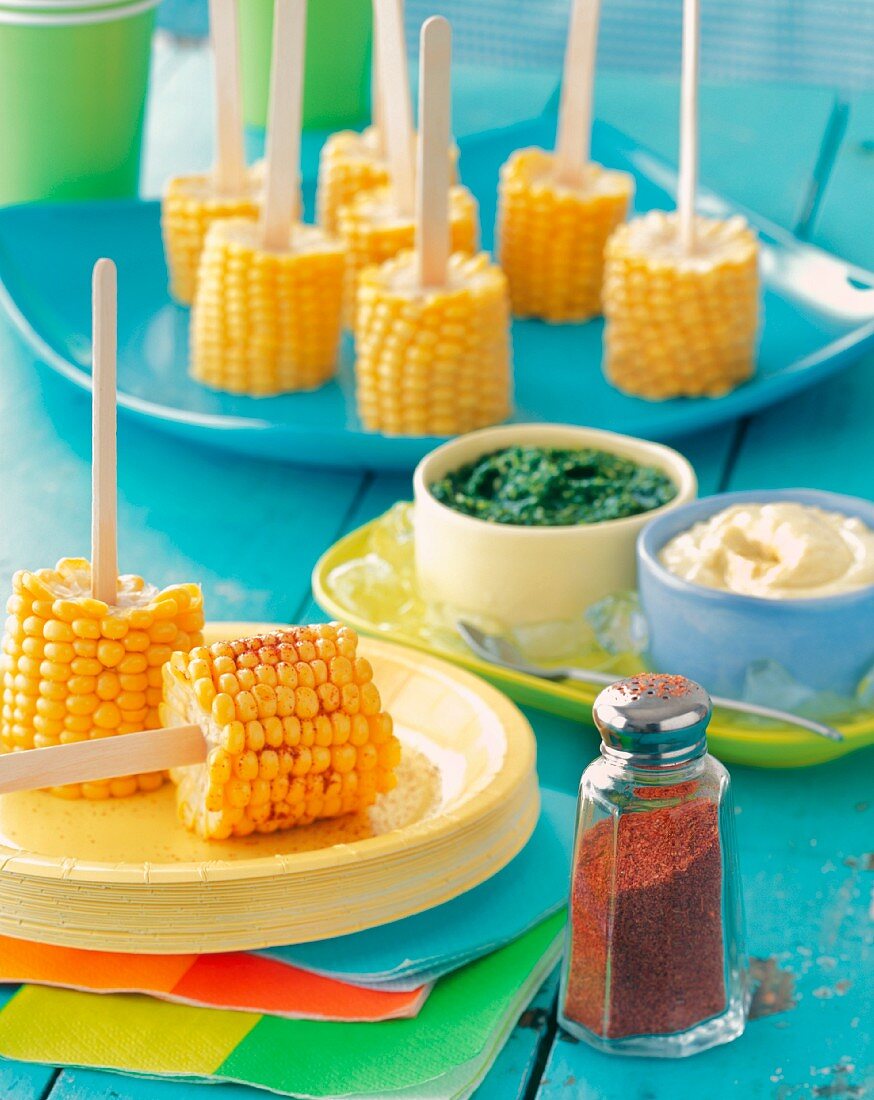 Corn on the Cob on Popsicle Sticks with Spices and Dips