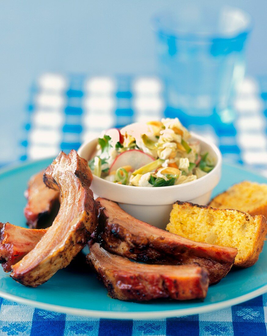 Ribs with Corn Bread and Cole Slaw on a Blue Plate