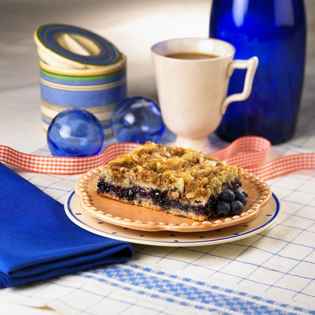 A Piece of Blueberry Coffee Cake with Coffee