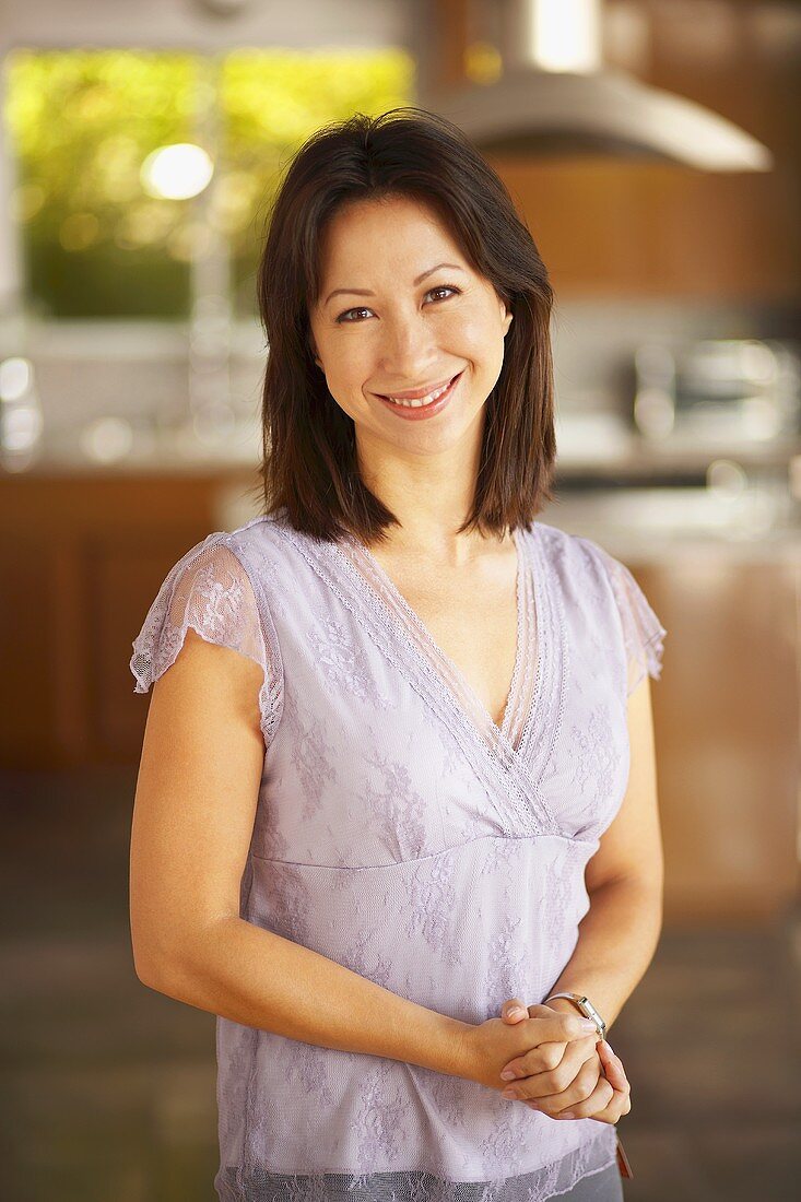 Smiling woman in kitchen