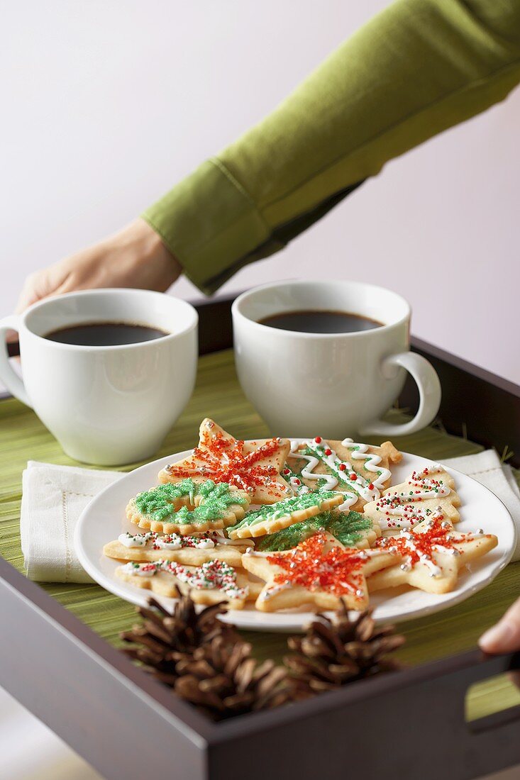 A Plate of Christmas Cookies with Two Cups of Coffee on a Tray