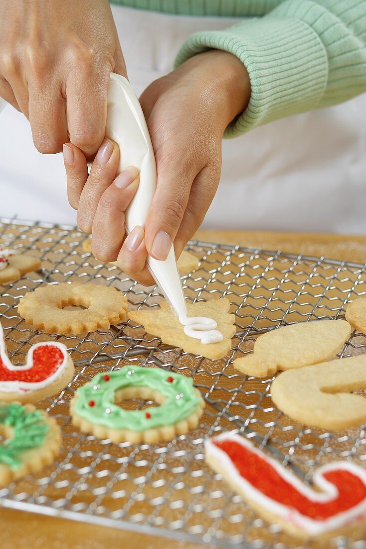 Squeezing Icing onto Holiday Cookies
