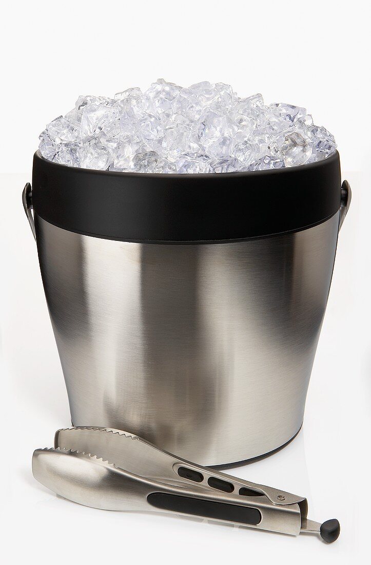 A Filled Ice Bucket with Tongs