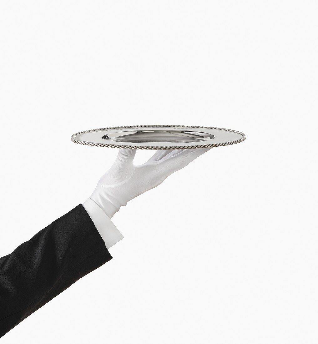 A Gloved Hand Holding a Silver Tray