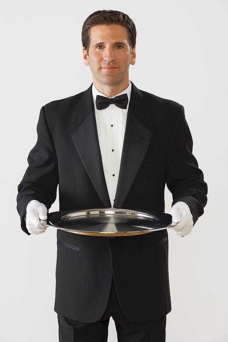 Butler holding a silver tray