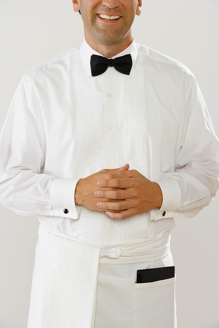Waiter in white uniform
