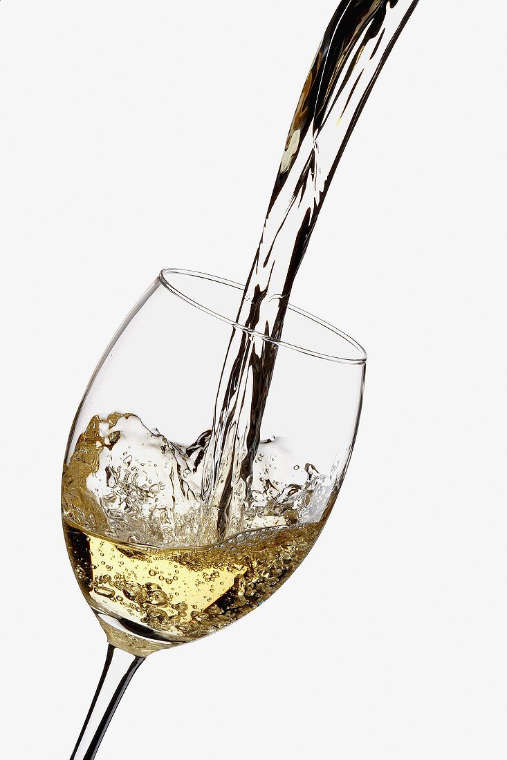 White Wine Pouring into a Glass