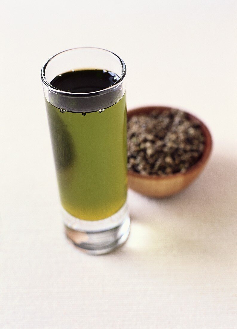 Hemp Oil in a Glass with Seeds