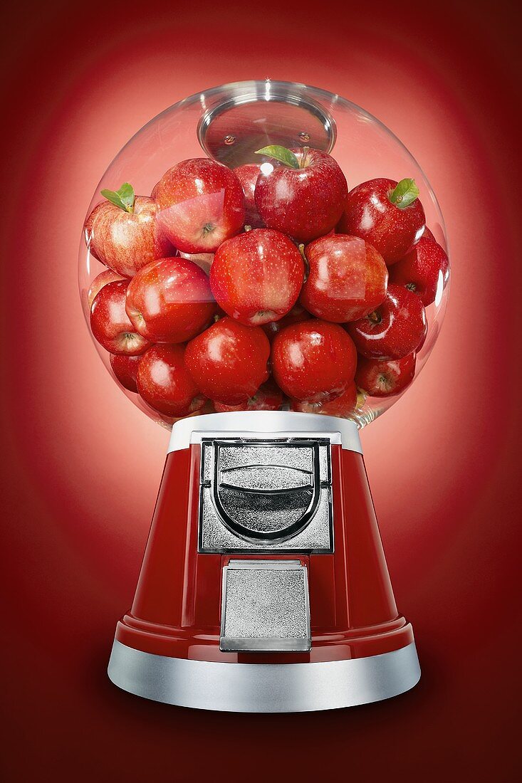 Rote Äpfel im Kaugummiautomat
