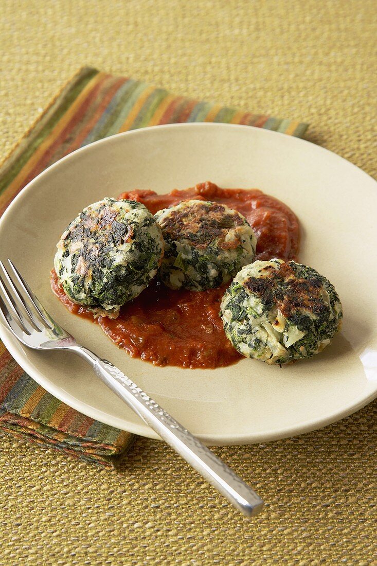 Spinach Cakes on Tomato Sauce