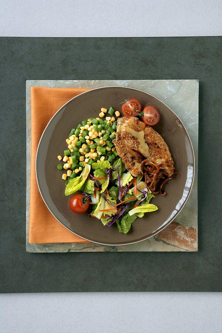 Breaded Chicken Strips with Salad and Corn with Scallions