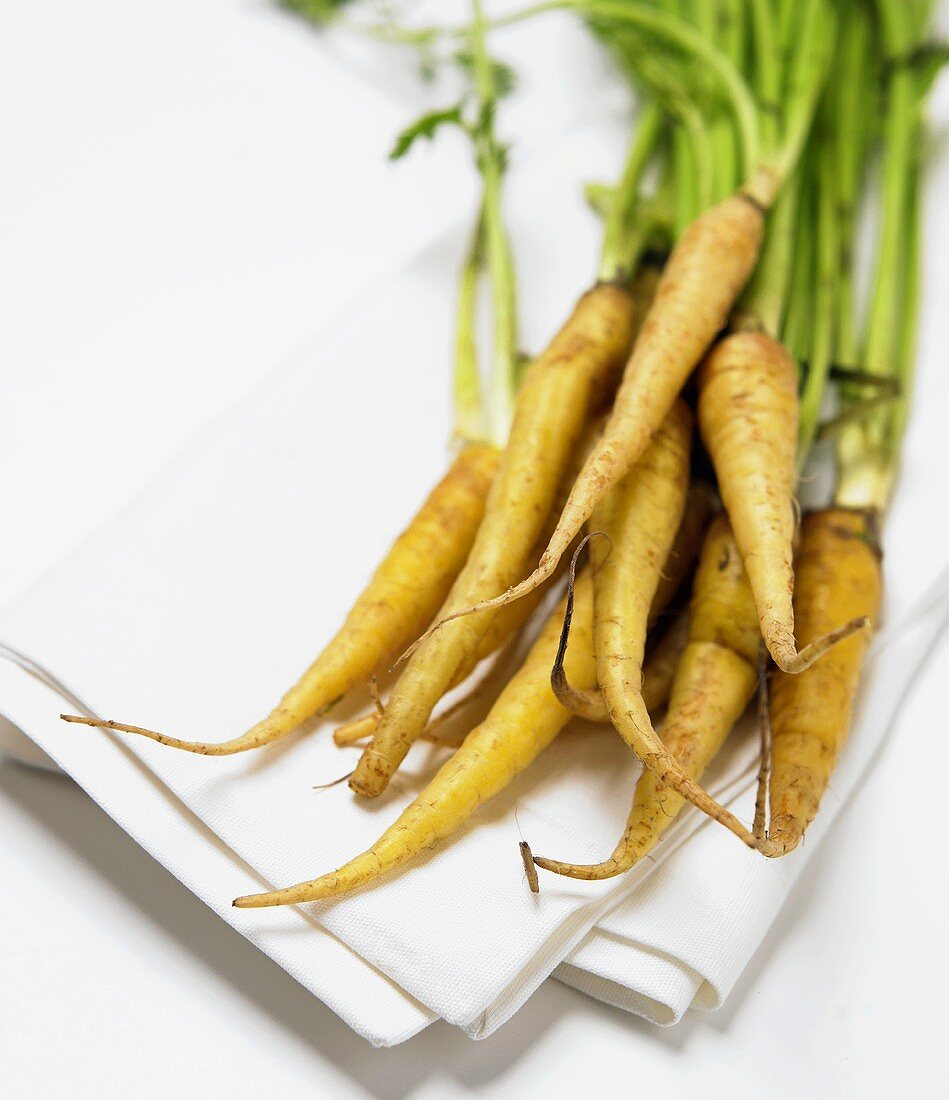 A Bunch of Fresh Carrots on a White Cloth