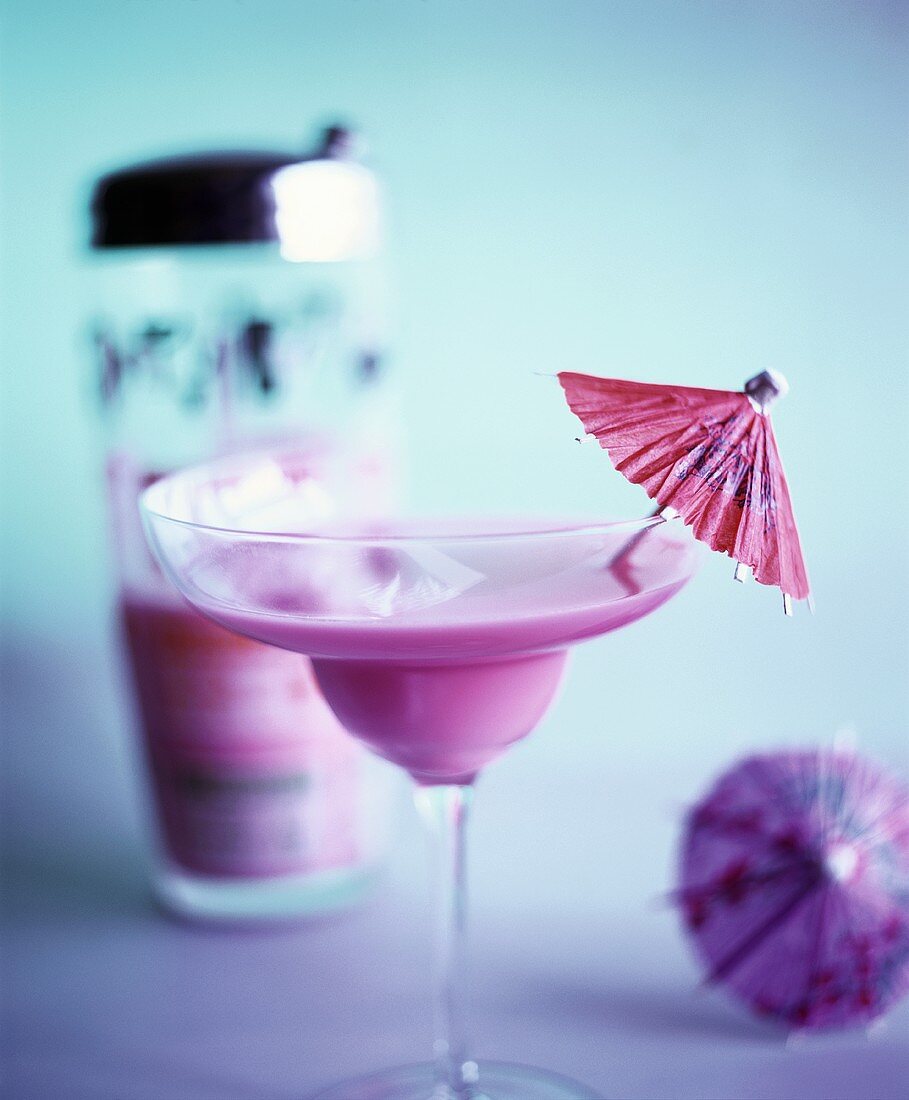 A Pink Lady with Cocktail Umbrella