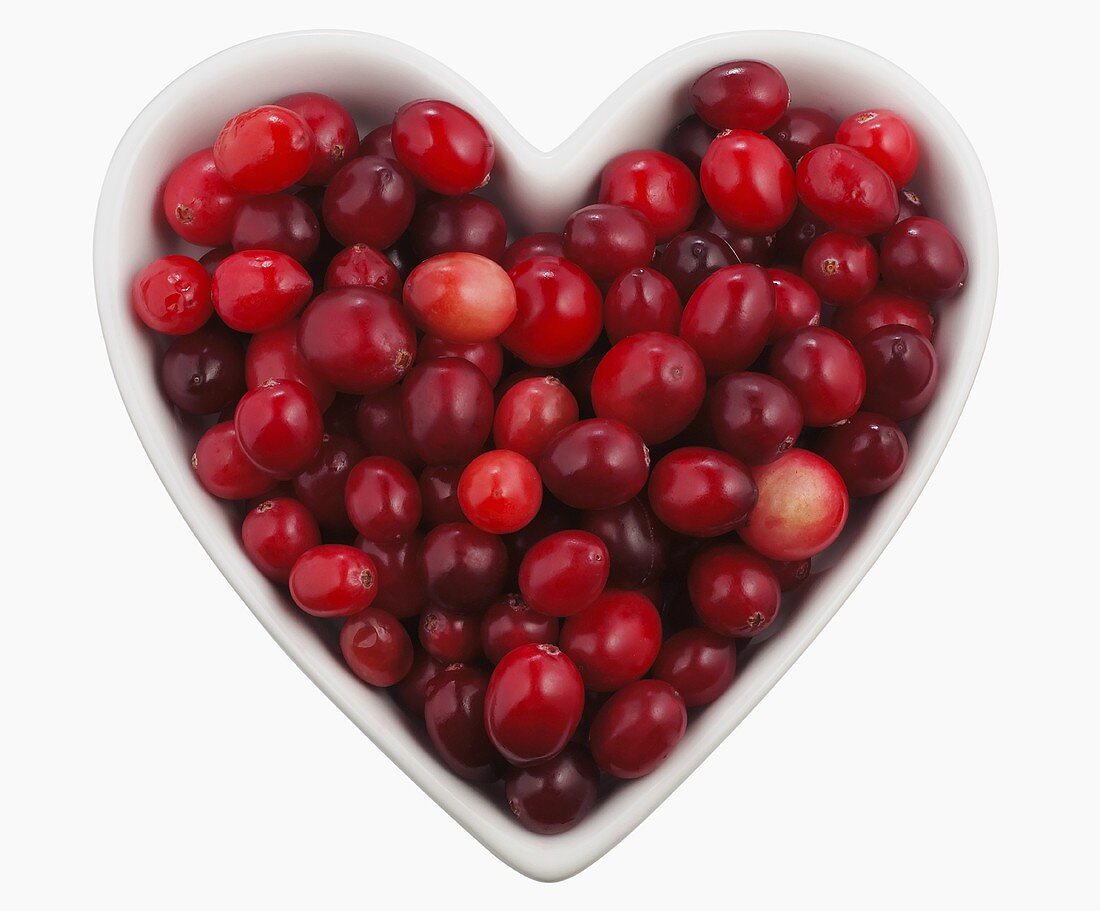 Overhead of Cranberries in a Heart Shaped Bowl; White Background