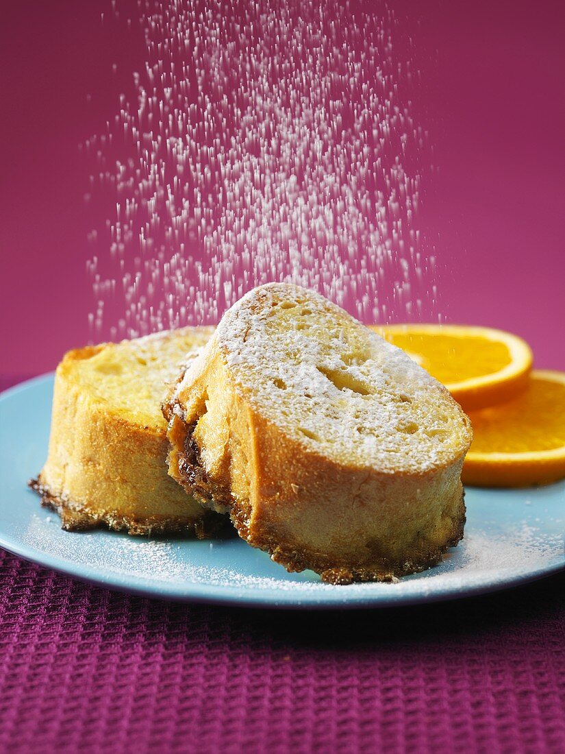 Sprinkling Powdered Sugar on French Toast