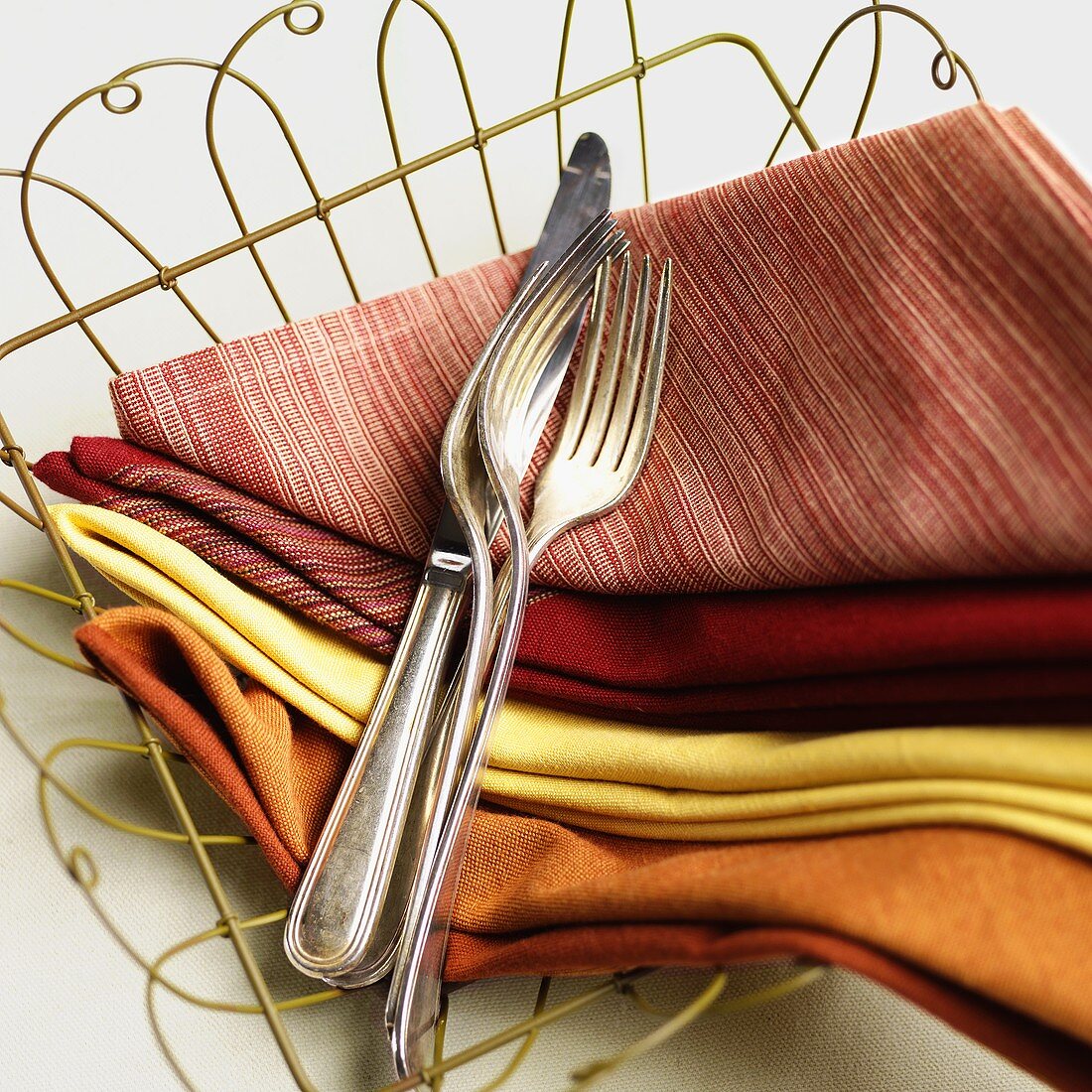 Napkins and Utensils in a Wire Basket