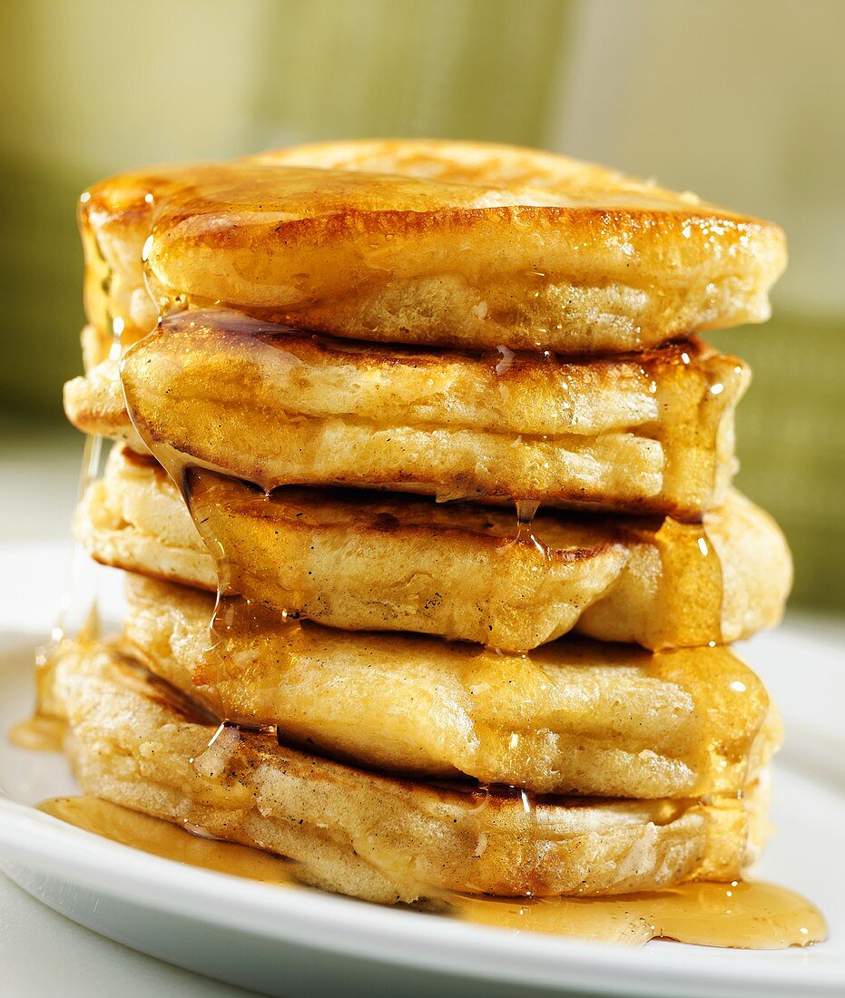 A Stack of Fluffy Pancakes with Maple Syrup