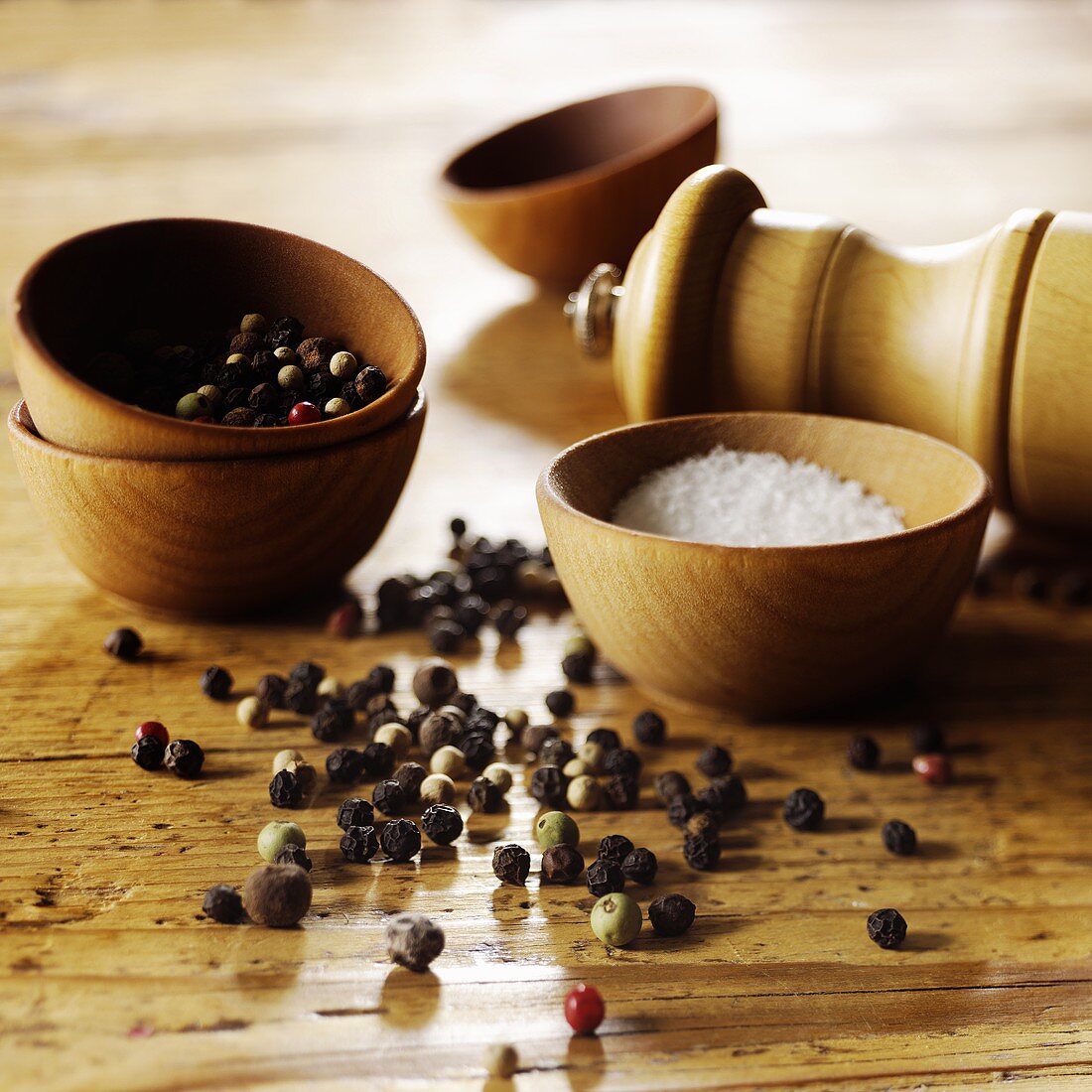 Peppercorns and Salt with Grinder and Wooden Bowls