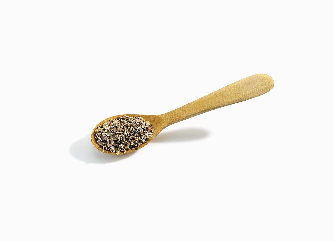 Wooden Spoonful of Dill Seed on White Background