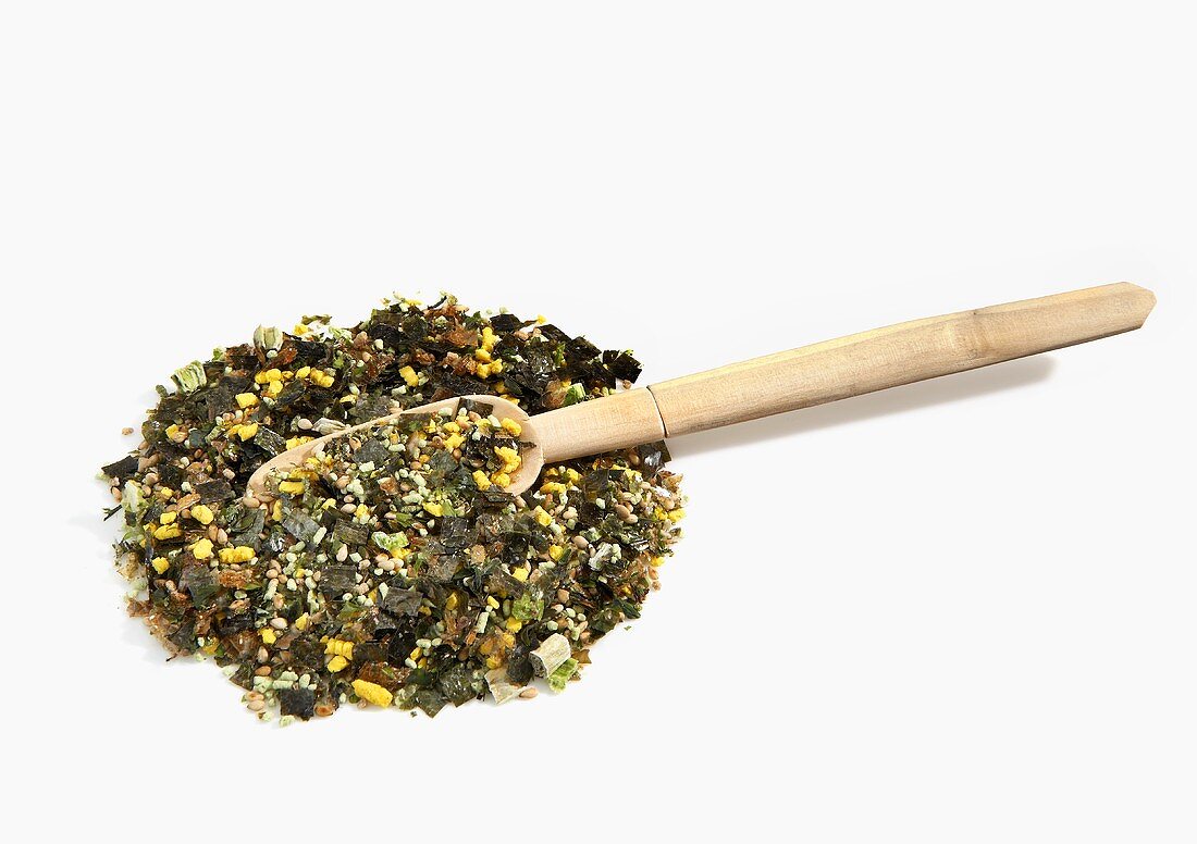 Pile of Wasabi Furikake with Wooden Spoon on White Background