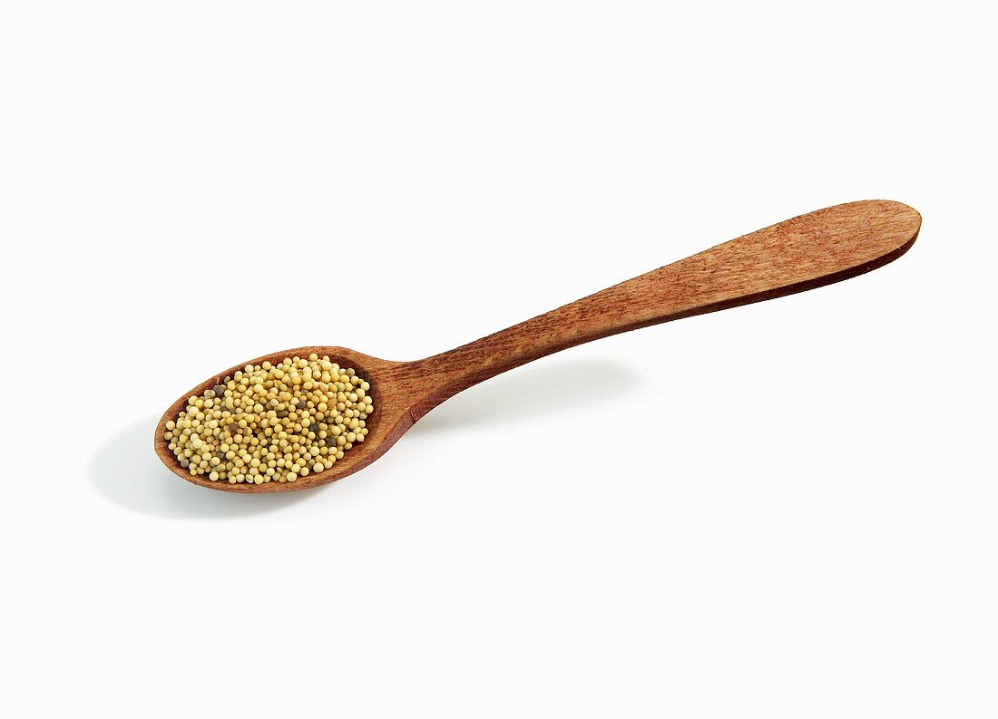 Wooden Spoonful of Mustard Seeds on White Background